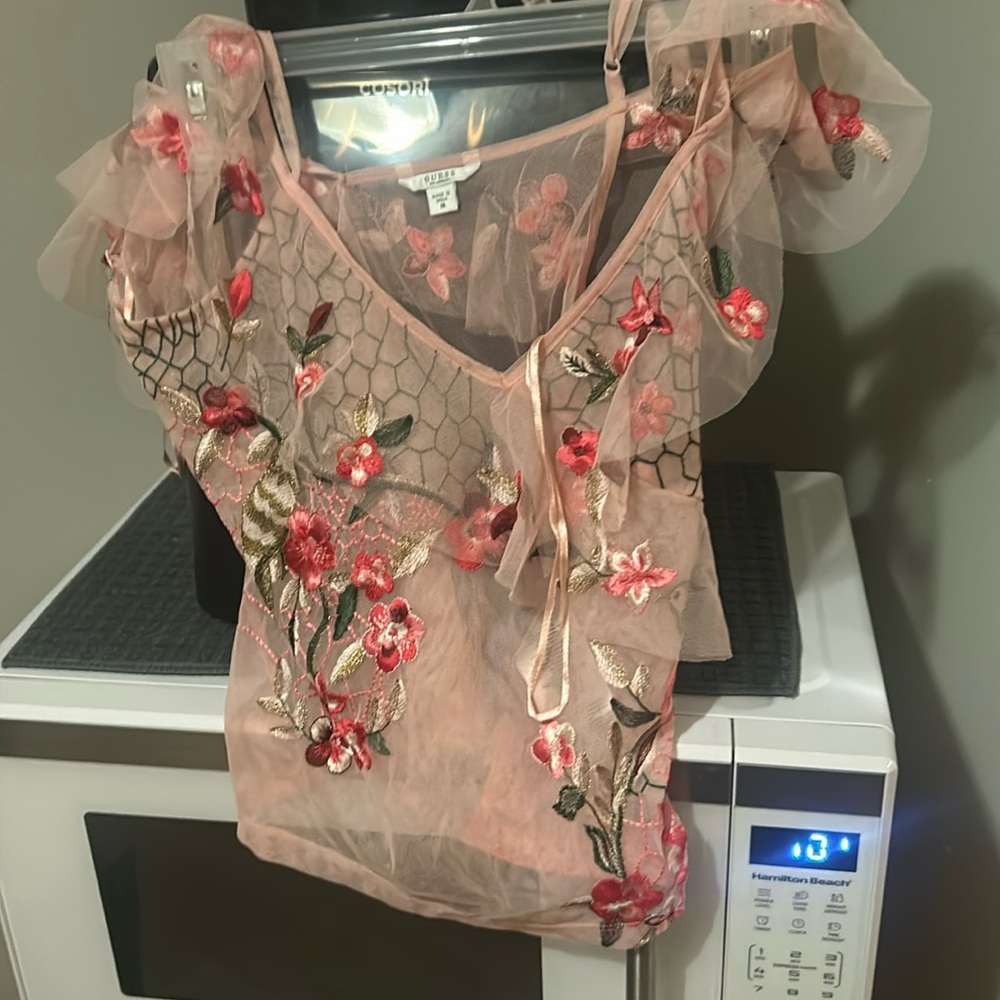 Guess sheer it’s adorable. I never wore it short sleeves